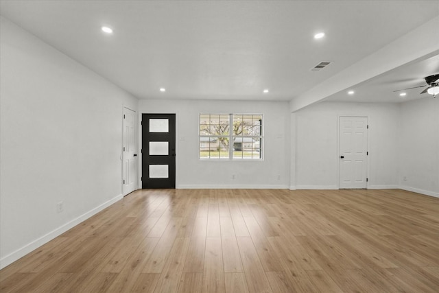 foyer entrance featuring ceiling fan and light hardwood / wood-style floors