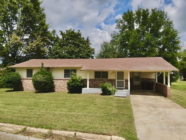 ranch-style house featuring a carport and a front yard