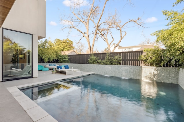 view of pool featuring a patio area and pool water feature