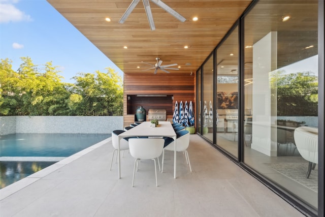 exterior space featuring ceiling fan