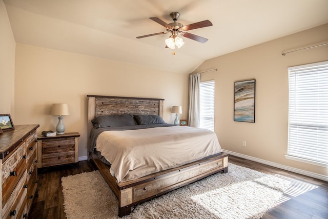 bedroom featuring dark wood-type flooring, ceiling fan, and vaulted ceiling