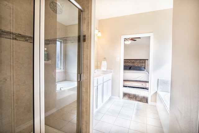 bathroom with vanity, tile patterned floors, independent shower and bath, and ceiling fan