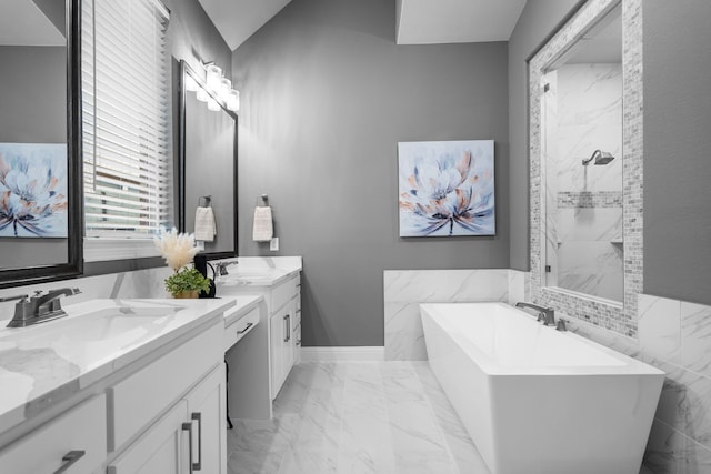 bathroom featuring vanity and separate shower and tub