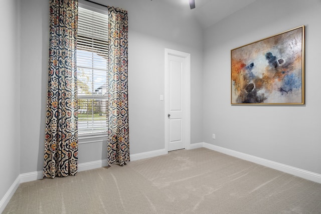 carpeted empty room with ceiling fan