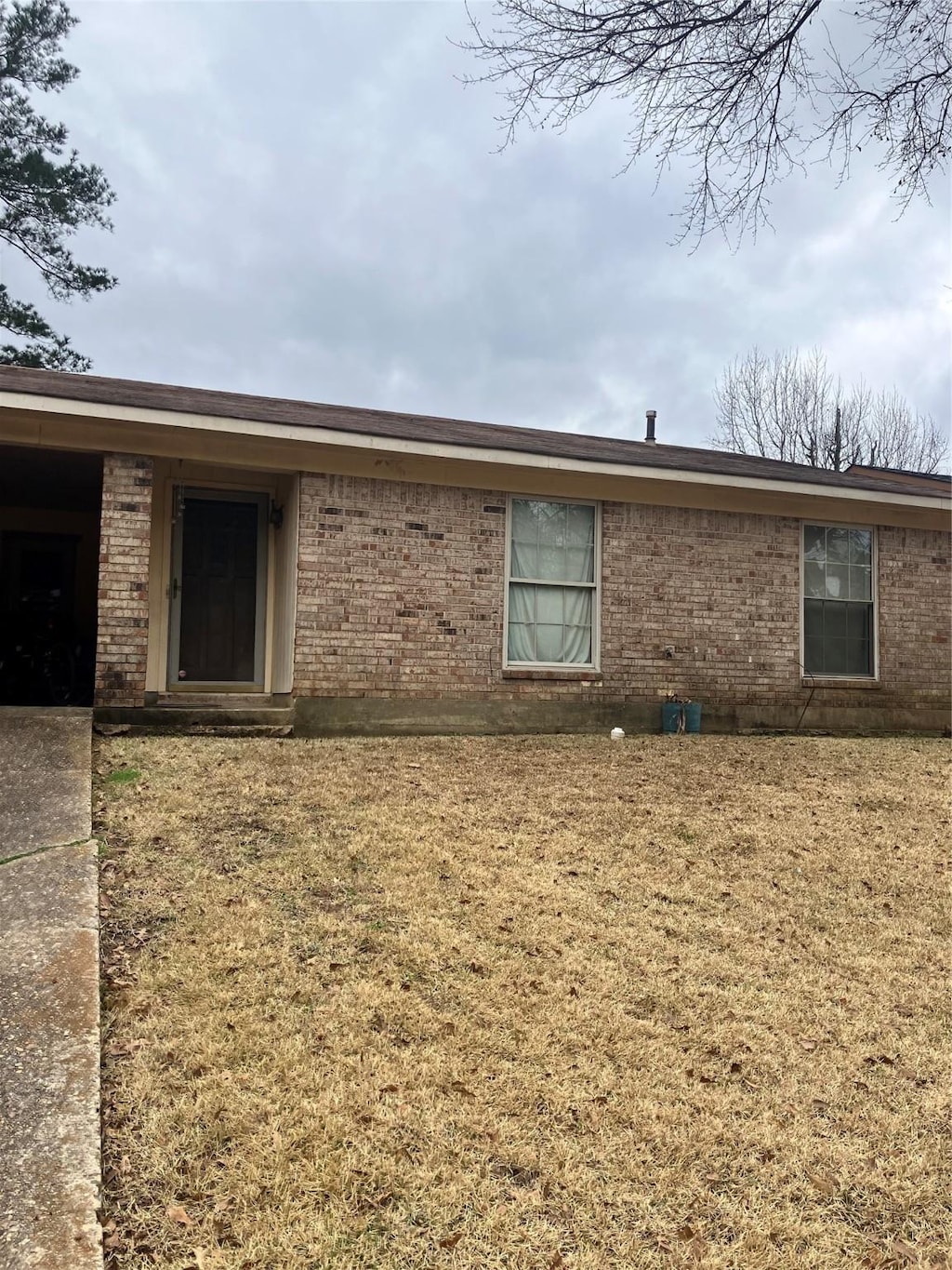 view of property exterior featuring a yard