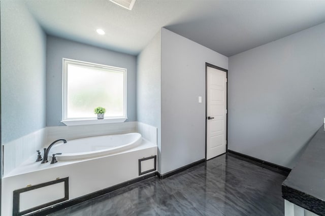 bathroom featuring a washtub