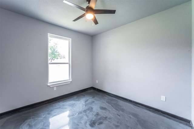 spare room with ceiling fan