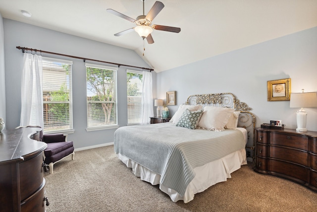 carpeted bedroom featuring vaulted ceiling and ceiling fan