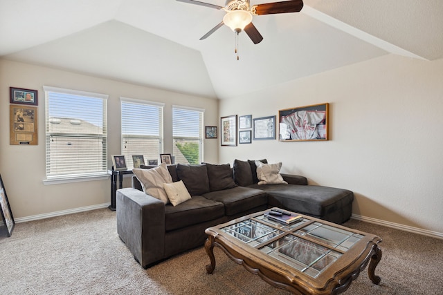 living room with ceiling fan, carpet flooring, and vaulted ceiling