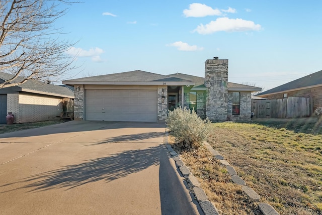 view of front facade featuring a garage and a front lawn