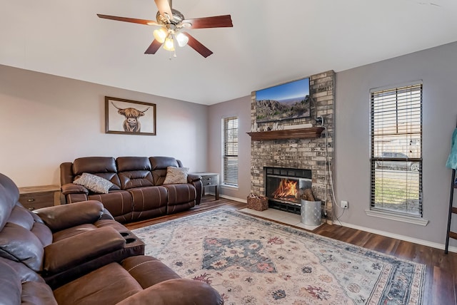 living room with hardwood / wood-style floors, a fireplace, and ceiling fan