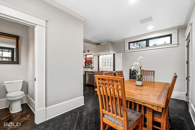 dining room with crown molding and dark hardwood / wood-style floors