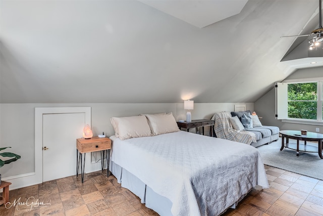 bedroom with lofted ceiling