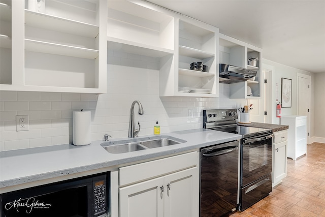 kitchen featuring white cabinets, sink, decorative backsplash, and black appliances