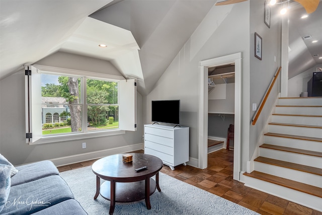 living room with vaulted ceiling and parquet floors