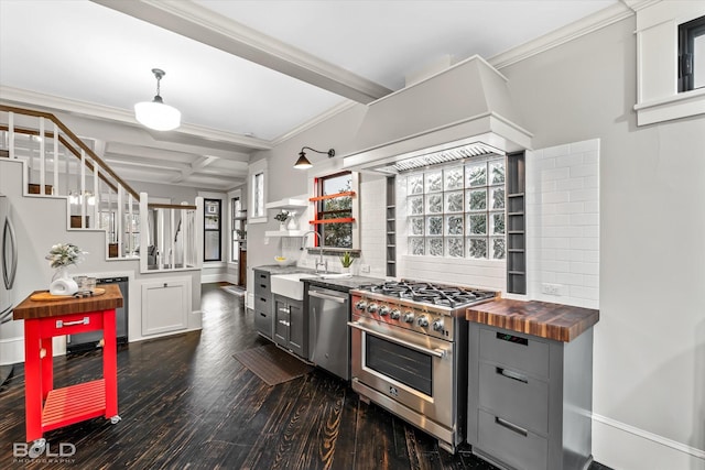 kitchen with butcher block countertops, sink, gray cabinets, stainless steel appliances, and coffered ceiling