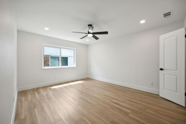 unfurnished room featuring ceiling fan and light wood-type flooring