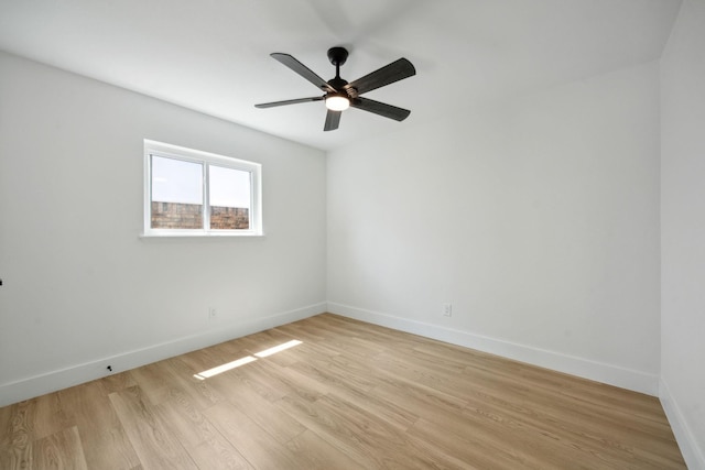 spare room featuring ceiling fan and light wood-type flooring