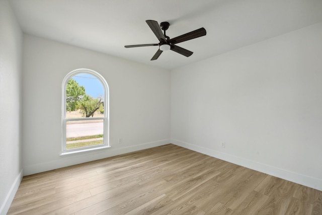 unfurnished room with light hardwood / wood-style flooring and ceiling fan