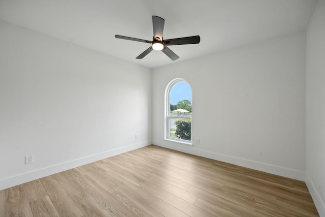 empty room with light hardwood / wood-style floors and ceiling fan