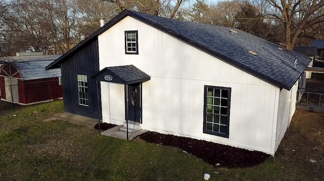 rear view of house with a yard