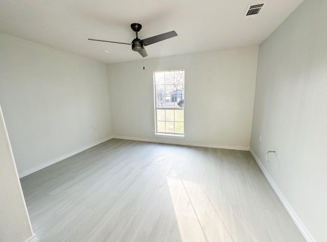 unfurnished room featuring ceiling fan and light hardwood / wood-style floors