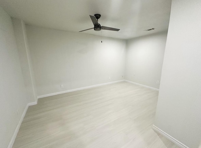 spare room featuring light hardwood / wood-style floors and ceiling fan