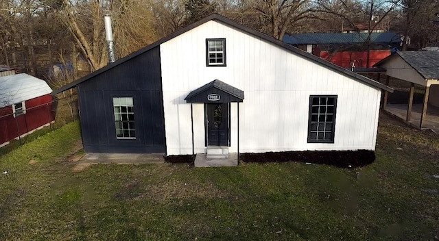 view of outbuilding with a yard