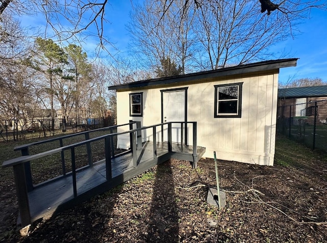 back of house with an outbuilding