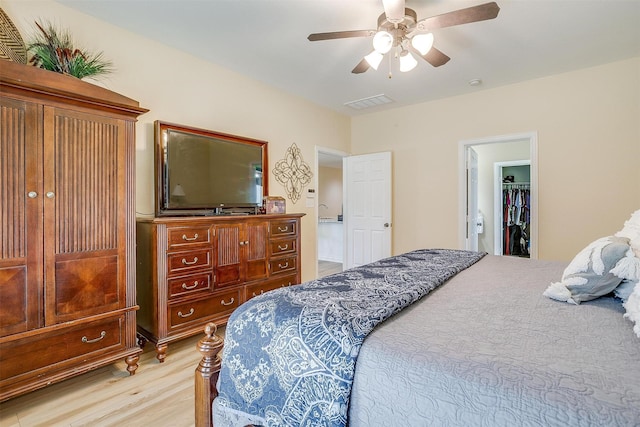 bedroom featuring light hardwood / wood-style floors and ceiling fan