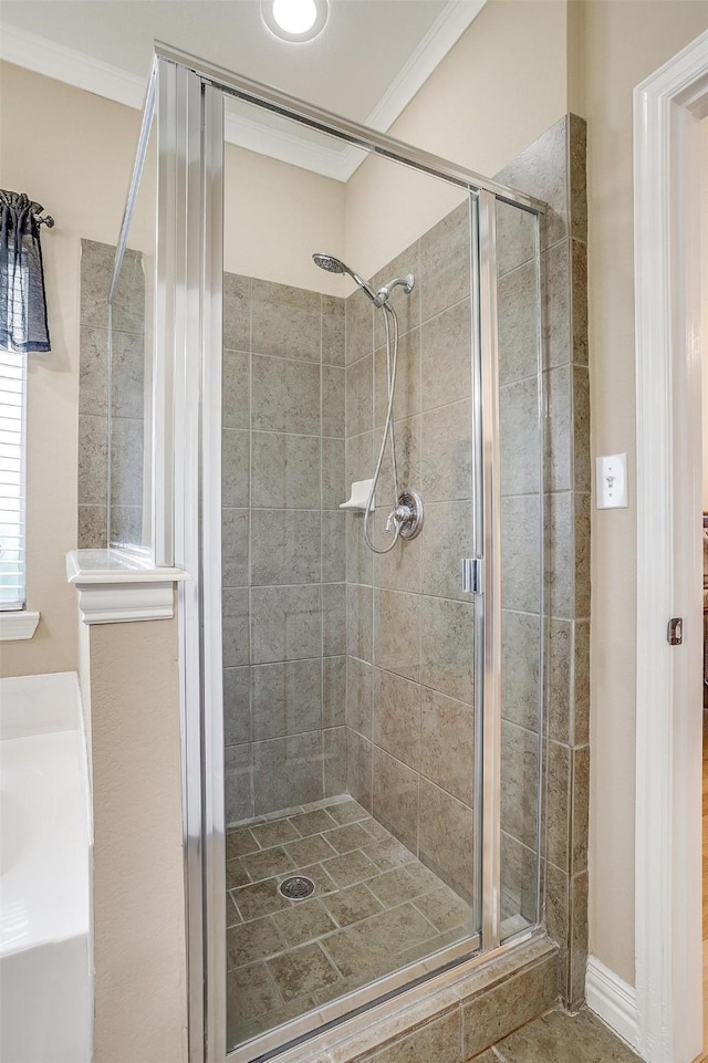 bathroom with ornamental molding and walk in shower