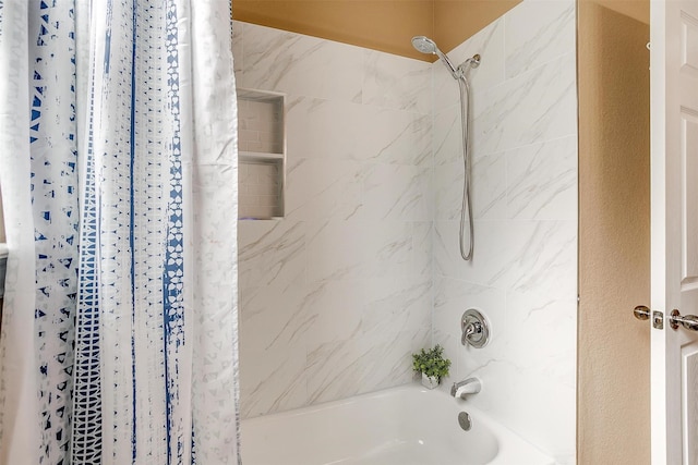 bathroom featuring shower / bathtub combination with curtain