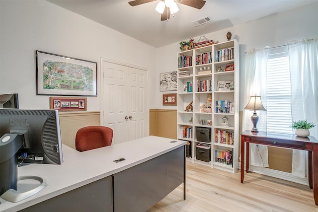 office with hardwood / wood-style flooring and ceiling fan