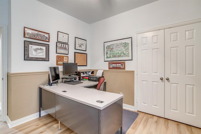 office with light wood-type flooring