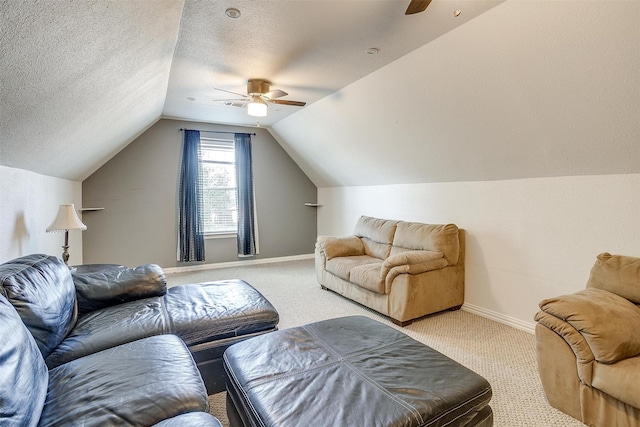 carpeted living room with lofted ceiling, a textured ceiling, and ceiling fan