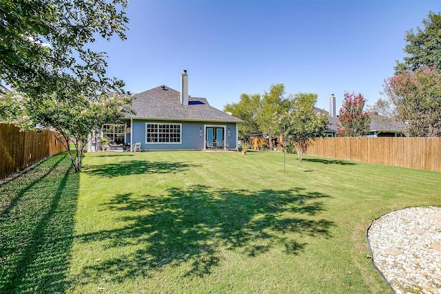 view of yard with french doors