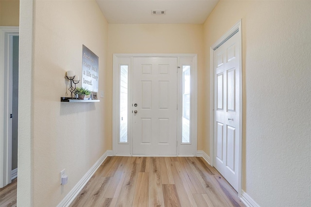 foyer entrance featuring light hardwood / wood-style flooring