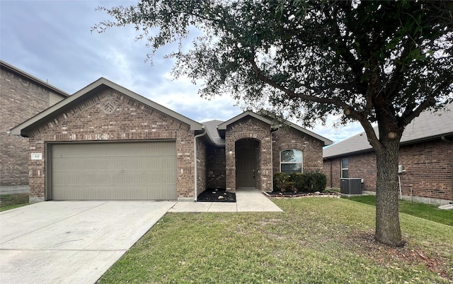 view of front facade with central AC unit, a garage, and a front yard