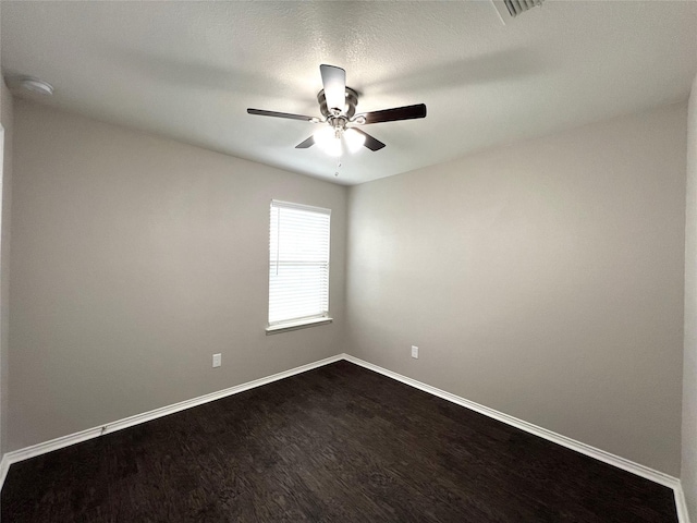 spare room with ceiling fan and hardwood / wood-style floors