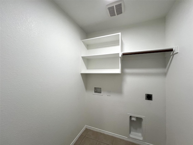 laundry room with hookup for a washing machine, hookup for an electric dryer, and tile patterned floors