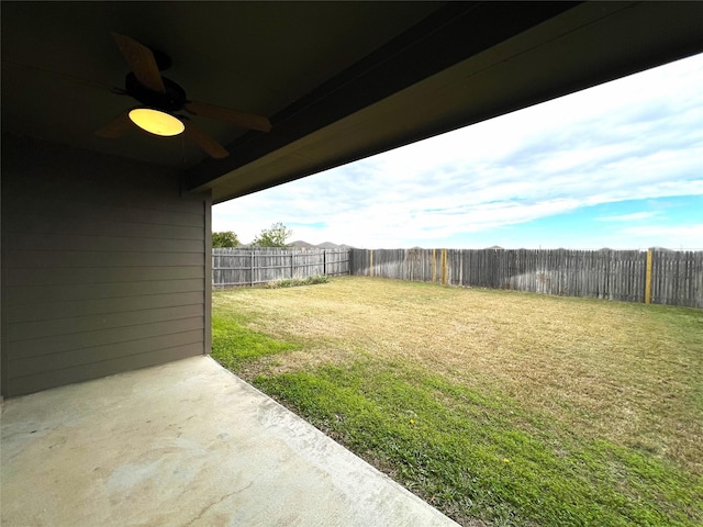 view of yard with ceiling fan