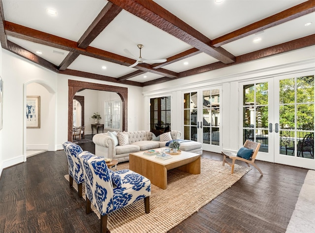 living room with french doors, coffered ceiling, beam ceiling, and dark hardwood / wood-style flooring