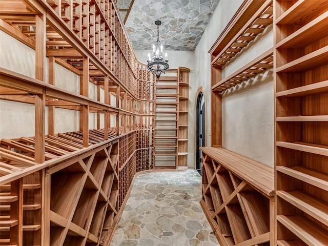 wine room featuring brick ceiling and a notable chandelier