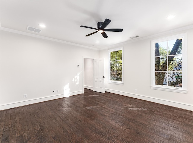 empty room featuring crown molding, ceiling fan, and dark hardwood / wood-style floors