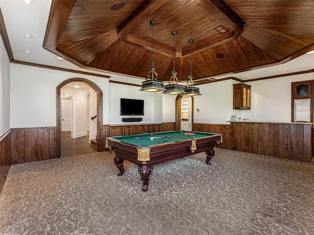 game room featuring billiards, wood walls, crown molding, wooden ceiling, and dark carpet