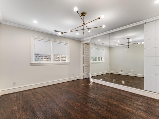 unfurnished room featuring ornamental molding and hardwood / wood-style floors