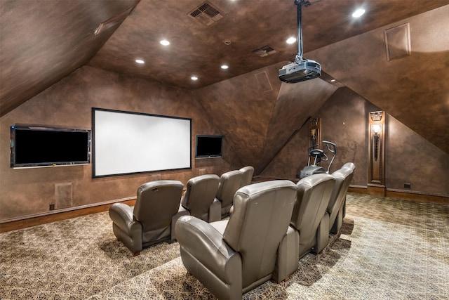 home theater featuring lofted ceiling and carpet