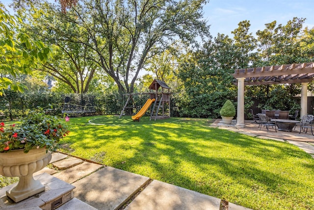 view of yard featuring a playground, a patio, a trampoline, an outdoor fire pit, and a pergola