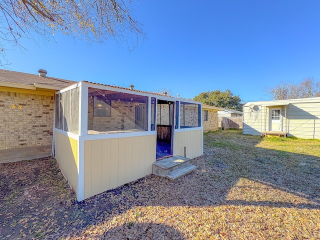 back of property with an outdoor structure