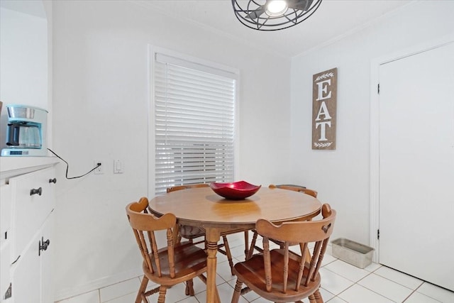 tiled dining space with ornamental molding